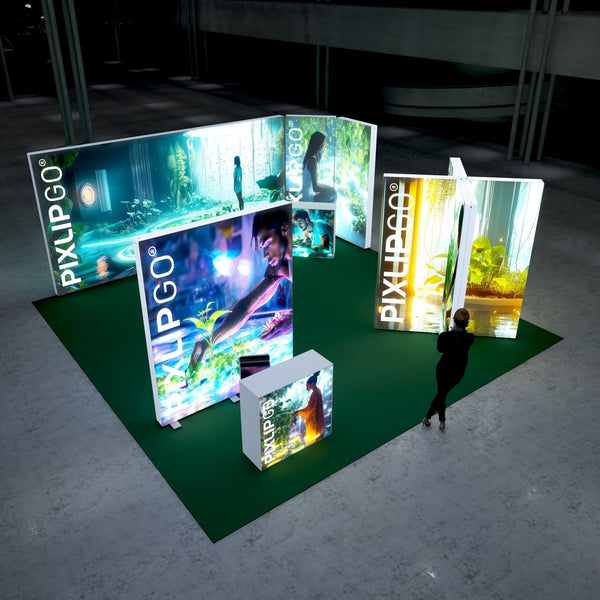 A dynamic trade show booth illuminated with vibrant colors and nature-themed imagery, featuring a lush green carpet and illuminated frames displaying a forest-like environment. A woman is seen interacting with the display, emphasizing a sense of tranquility and sustainability.